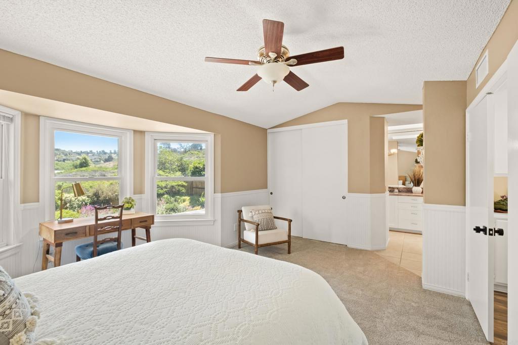 1361 Hodges Road Oceanside, CA 92056 - Photo 27 of 39 a bedroom with a bed and a large window