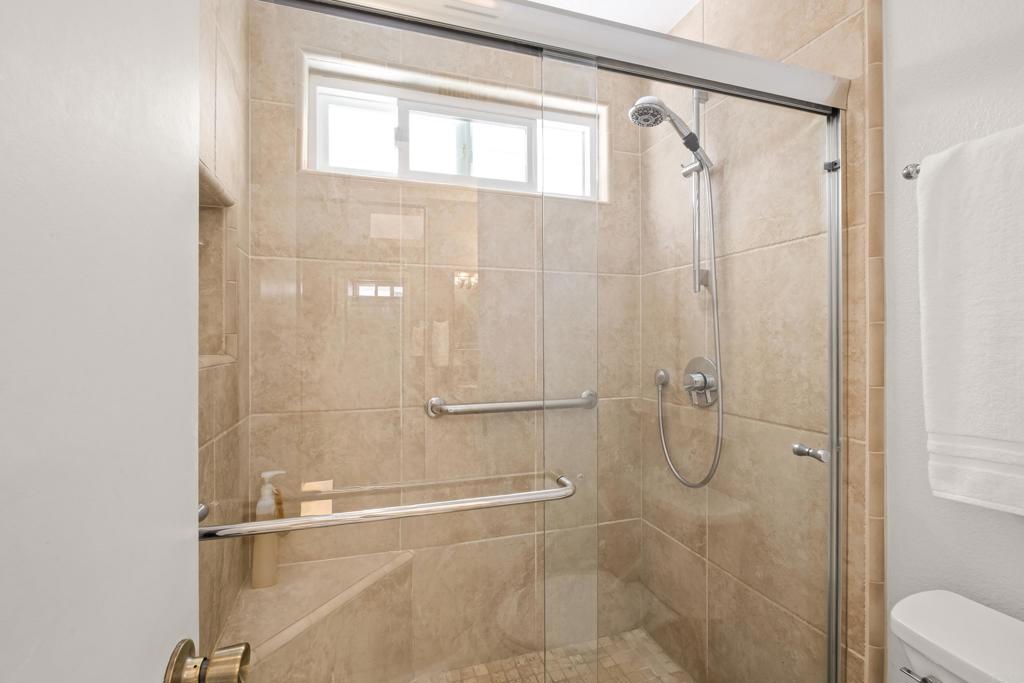 1361 Hodges Road Oceanside, CA 92056 - Photo 30 of 39 a bathroom with a glass shower door