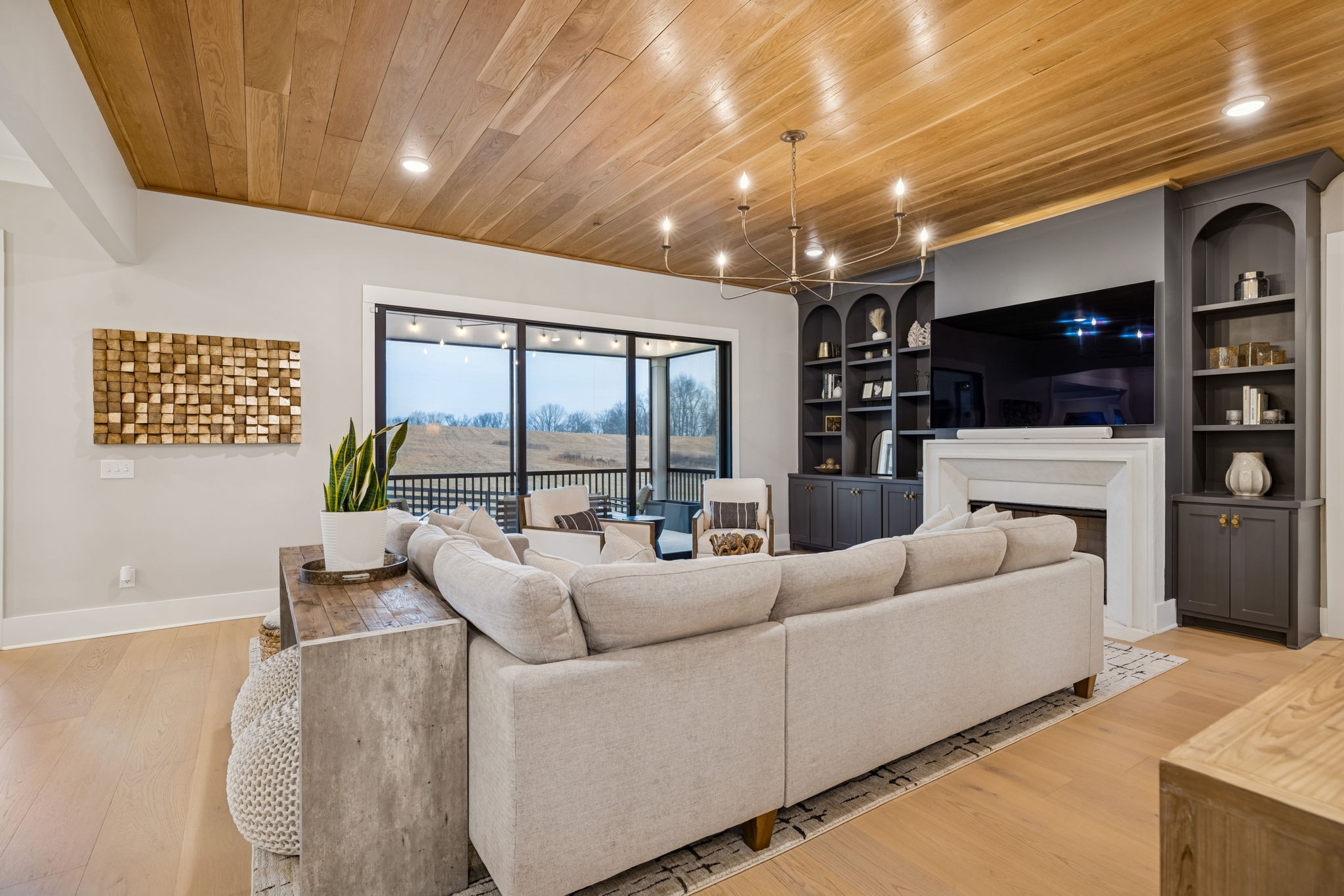 137 Alfred Ladd Road Franklin, TN 37064 - Photo 21 of 99 a living room with furniture a flat screen tv and a large window