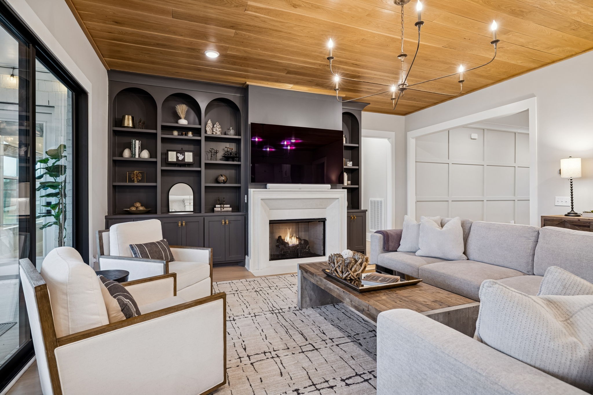 137 Alfred Ladd Road Franklin, TN 37064 - Photo 24 of 99 a living room with furniture a flat screen tv and a fireplace