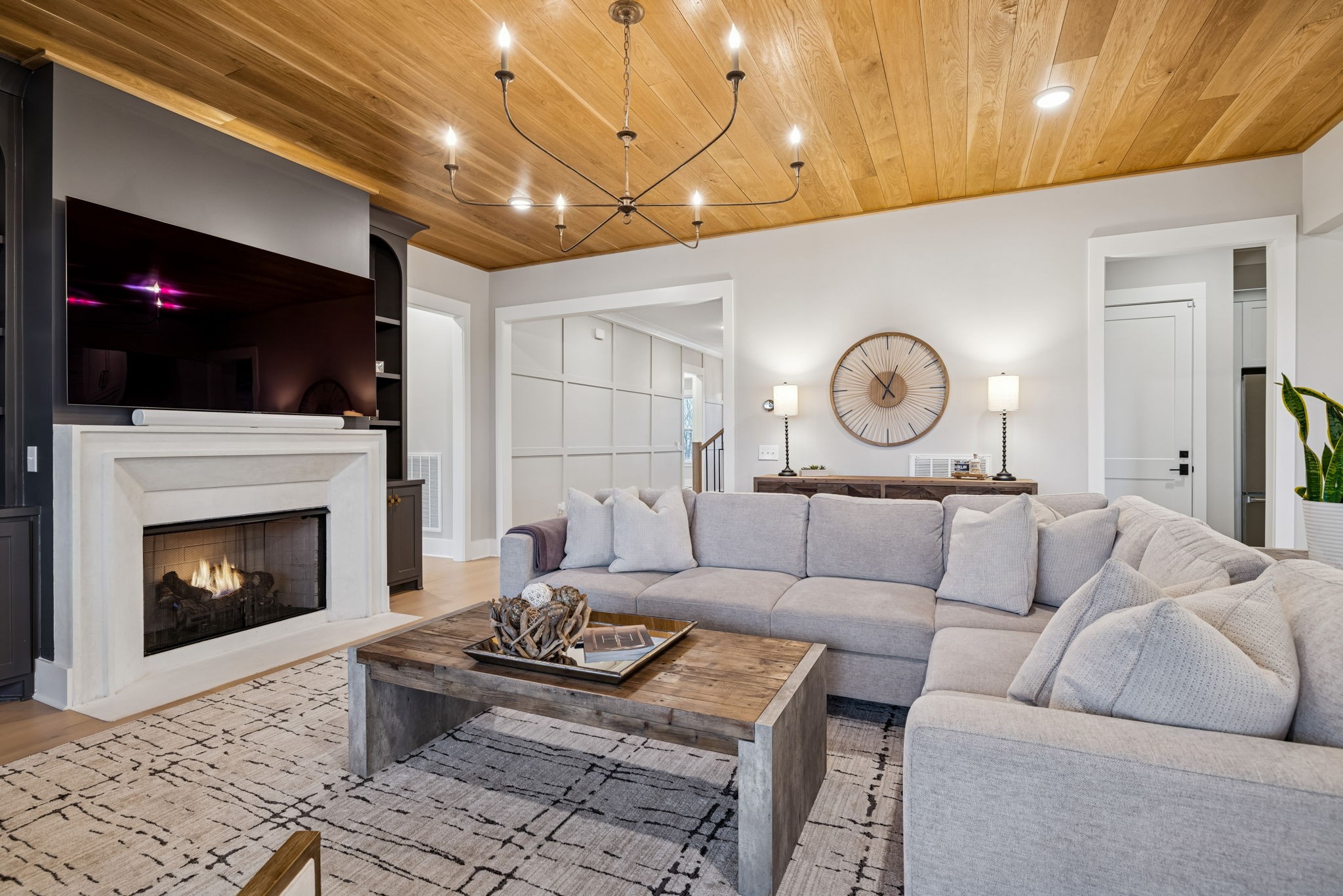 137 Alfred Ladd Road Franklin, TN 37064 - Photo 25 of 99 a living room with furniture a fireplace and a flat screen tv