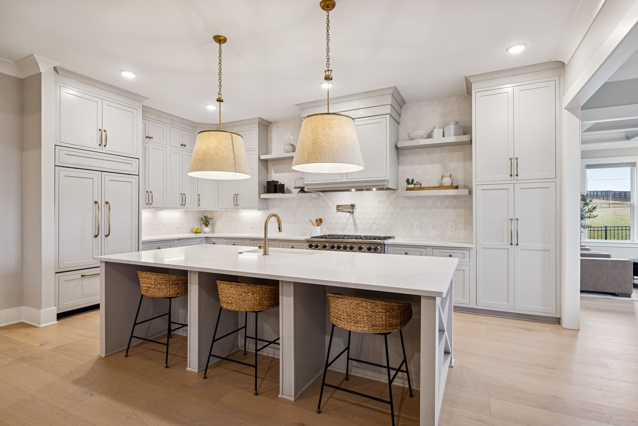 137 Alfred Ladd Road Franklin, TN 37064 - Photo 29 of 99 a kitchen with stainless steel appliances granite countertop a sink a stove a refrigerator cabinets and chairs