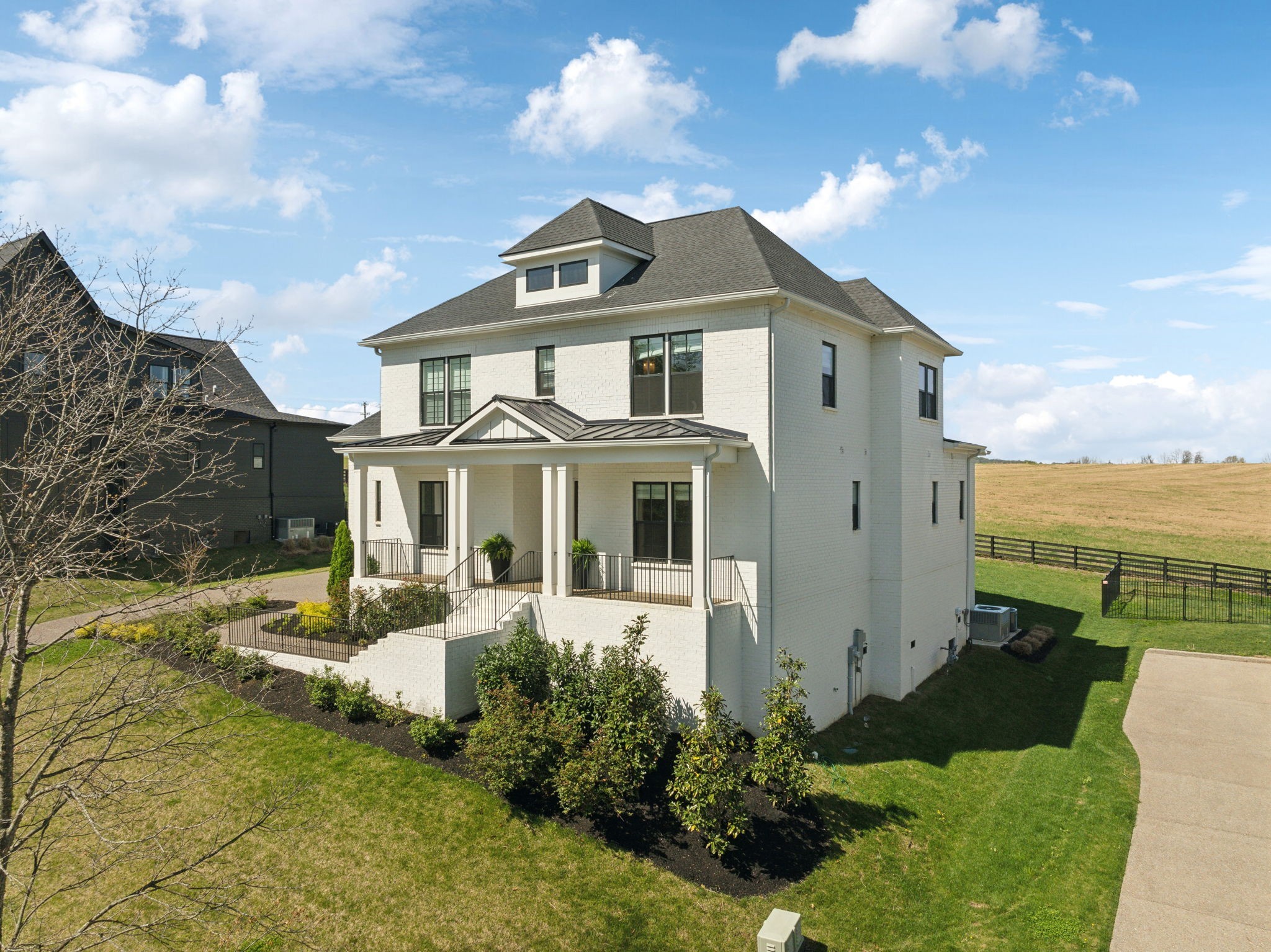 137 Alfred Ladd Road Franklin, TN 37064 - Photo 4 of 99 a front view of a house with a yard