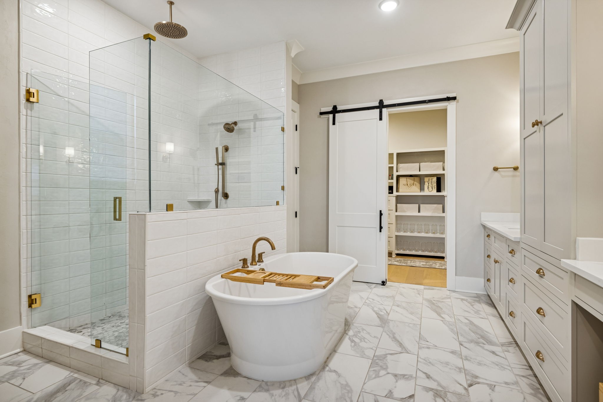 137 Alfred Ladd Road Franklin, TN 37064 - Photo 63 of 99 a bathroom with a tub a sink and a shower