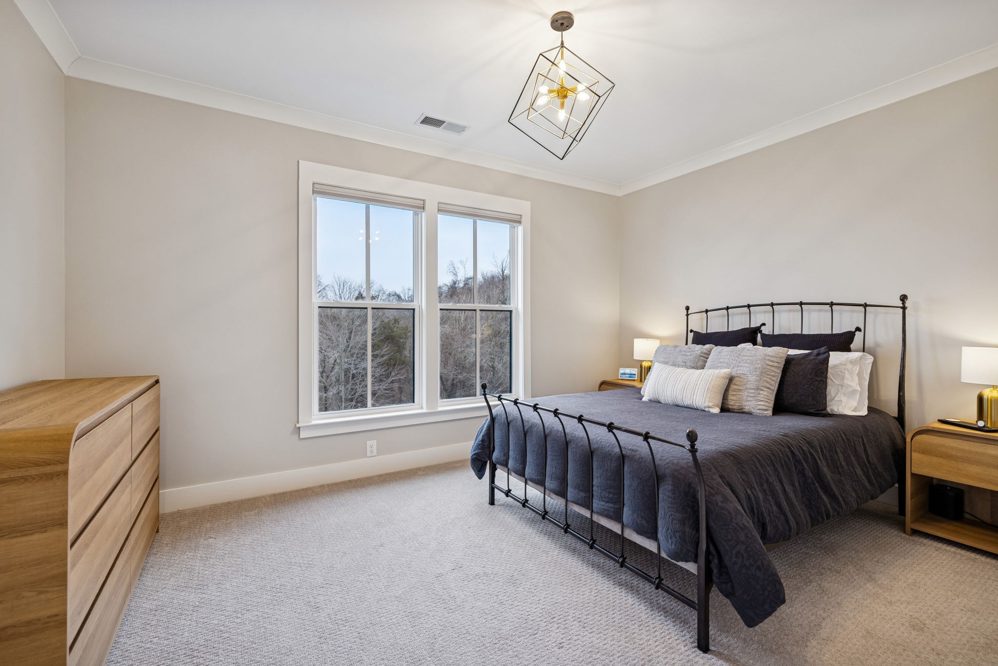 137 Alfred Ladd Road Franklin, TN 37064 - Photo 78 of 99 a bedroom with a bed lamp and a window