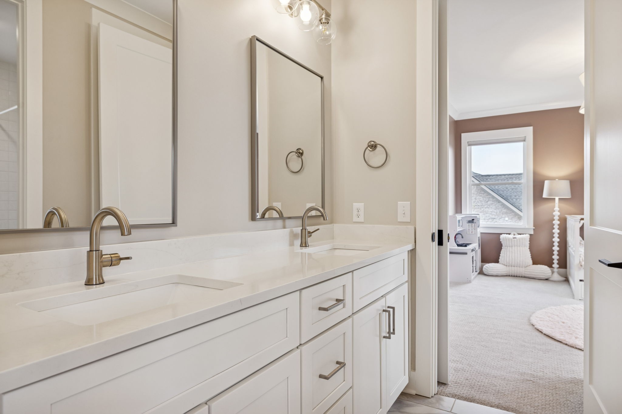 137 Alfred Ladd Road Franklin, TN 37064 - Photo 79 of 99 a bathroom with double vanity sinks a large mirror and a shower
