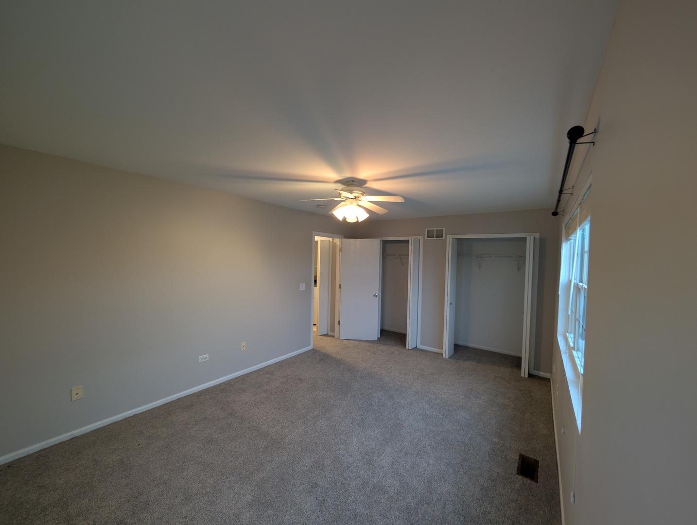 671 Fieldcrest Drive South Elgin, IL 60177 - Photo 15 of 22 a view of an empty room with a ceiling fan