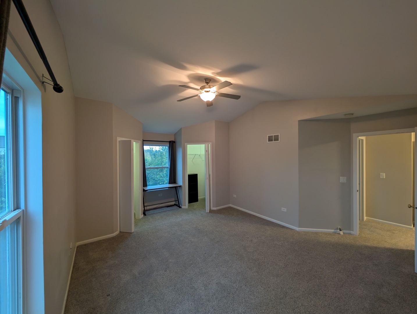 671 Fieldcrest Drive South Elgin, IL 60177 - Photo 19 of 22 a view of an empty room with a ceiling fan