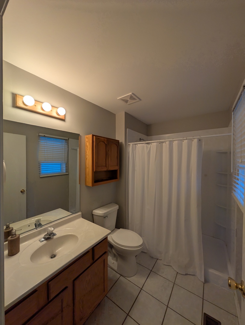 671 Fieldcrest Drive South Elgin, IL 60177 - Photo 20 of 22 a bathroom with a sink a toilet and mirror