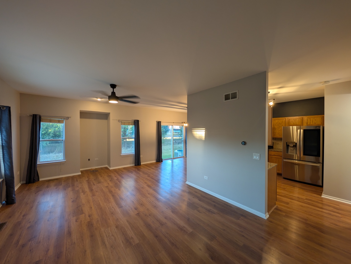 671 Fieldcrest Drive South Elgin, IL 60177 - Photo 2 of 22 an empty room with wooden floor and chandelier