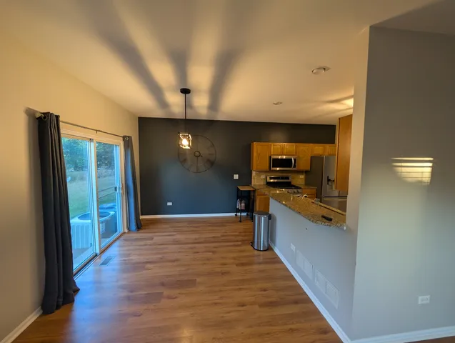 a view of a living room with a flat screen tv