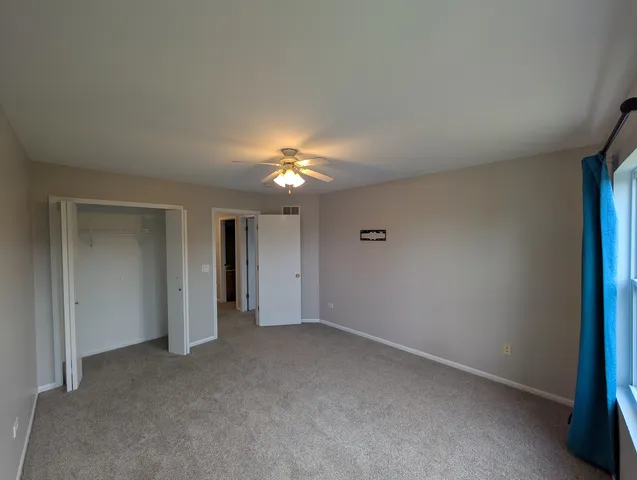 an empty room with a bathroom