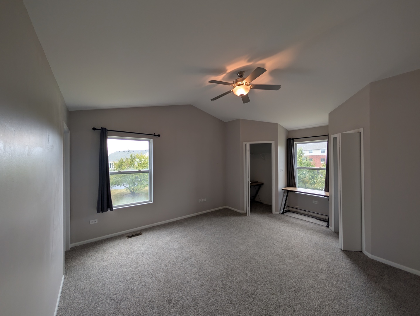 671 Fieldcrest Drive South Elgin, IL 60177 - Photo 10 of 22 an empty room with windows and fan