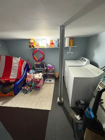 a bathroom with a sink toilet and window