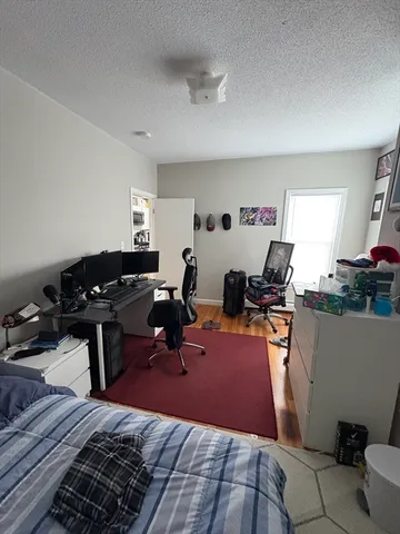 a room with furniture a rug and a window