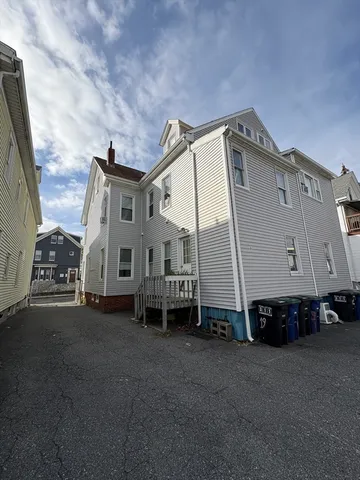 a view of a large building with a yard