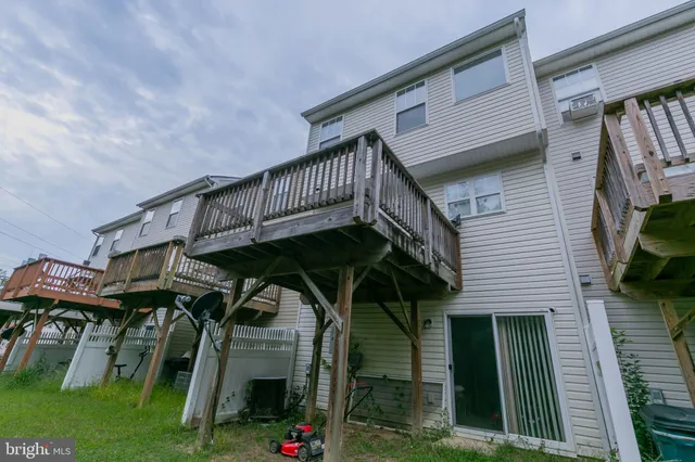a view of a chairs and table in the balcony