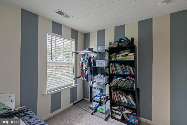 a view of a livingroom with furniture and closet