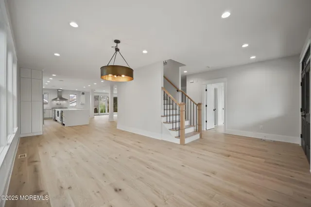 a kitchen with stainless steel appliances granite countertop a stove and a microwave