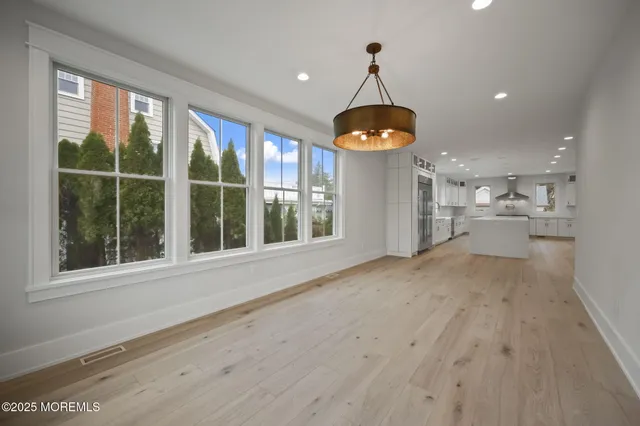 a bathroom with a bathtub and window