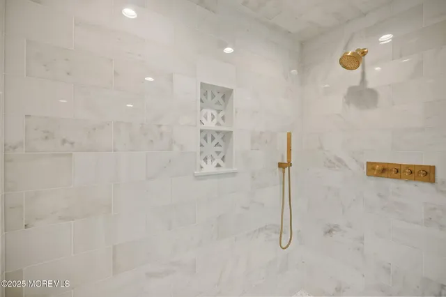a picture of a bathroom with a shower