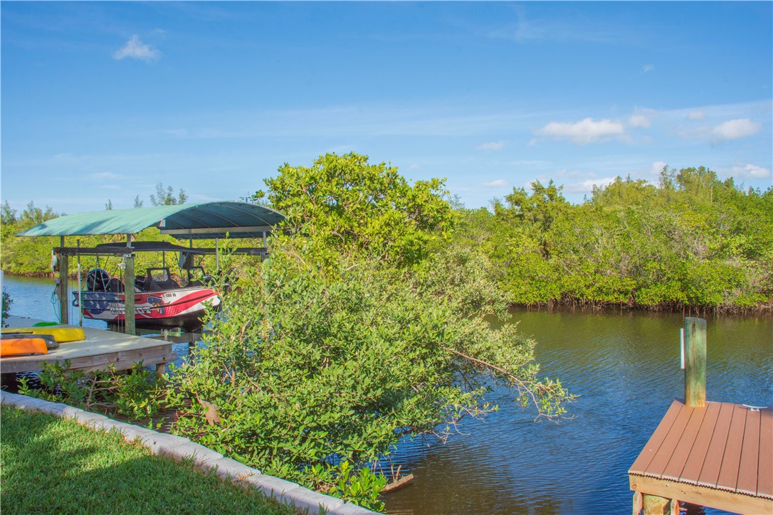 922 Jackson Way Fort Pierce, FL 34949 - Photo 33 of 34 a view of a lake with houses