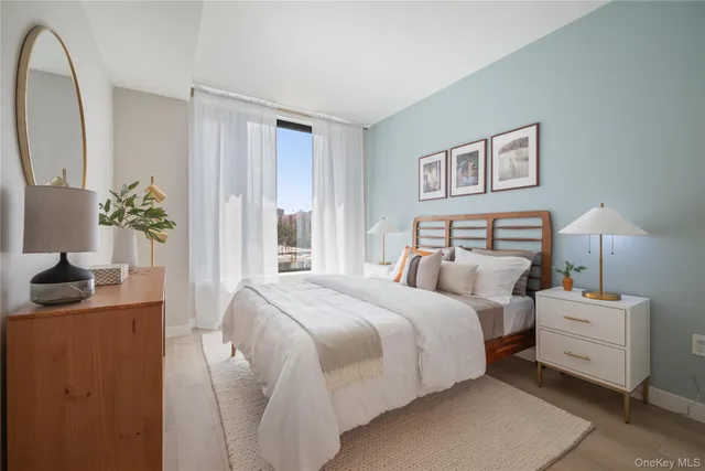 a bedroom with bed and window