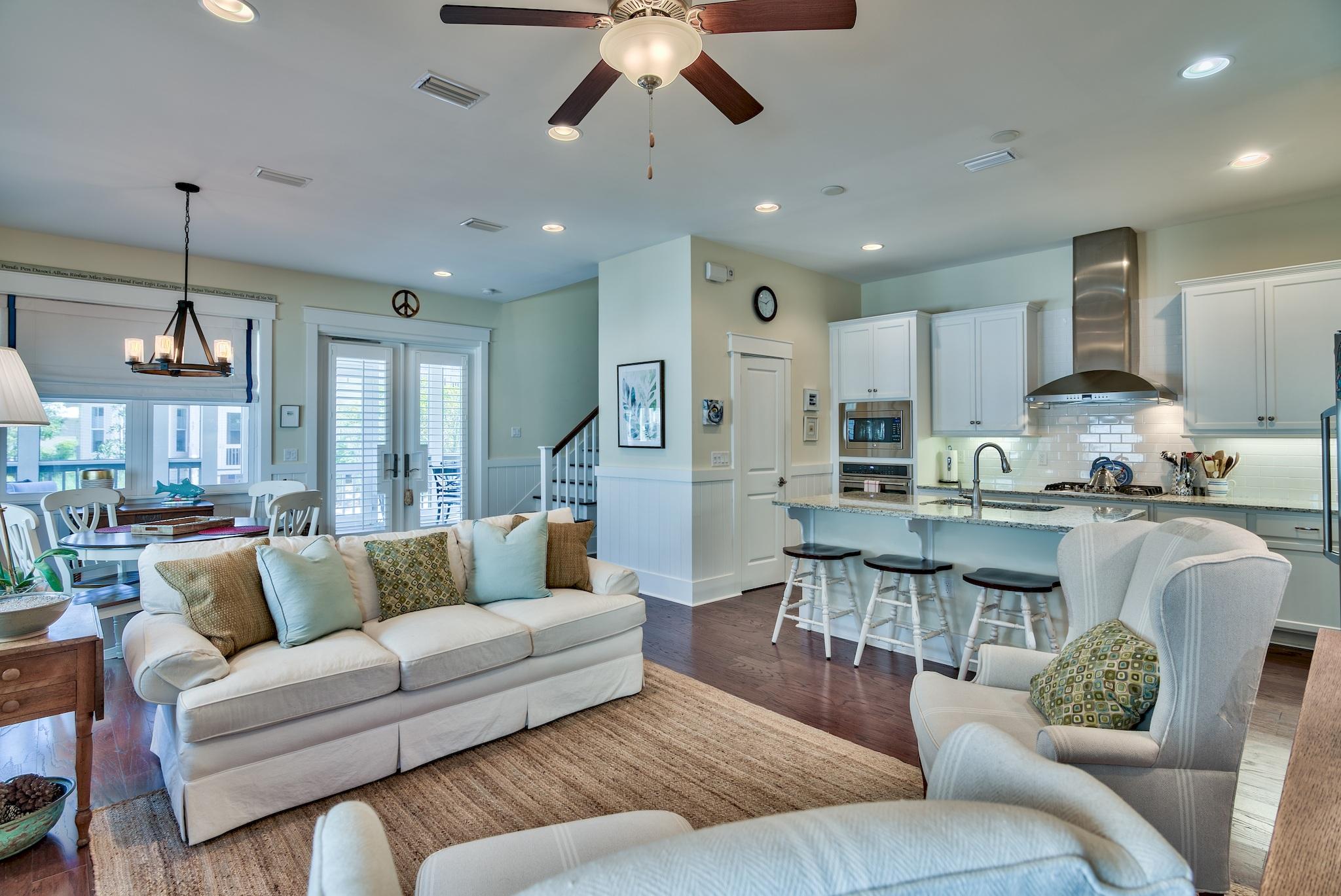 664 Flatwoods Forest Loop Santa Rosa Beach, FL 32459 - Photo 33 of 33 a living room with furniture and kitchen view