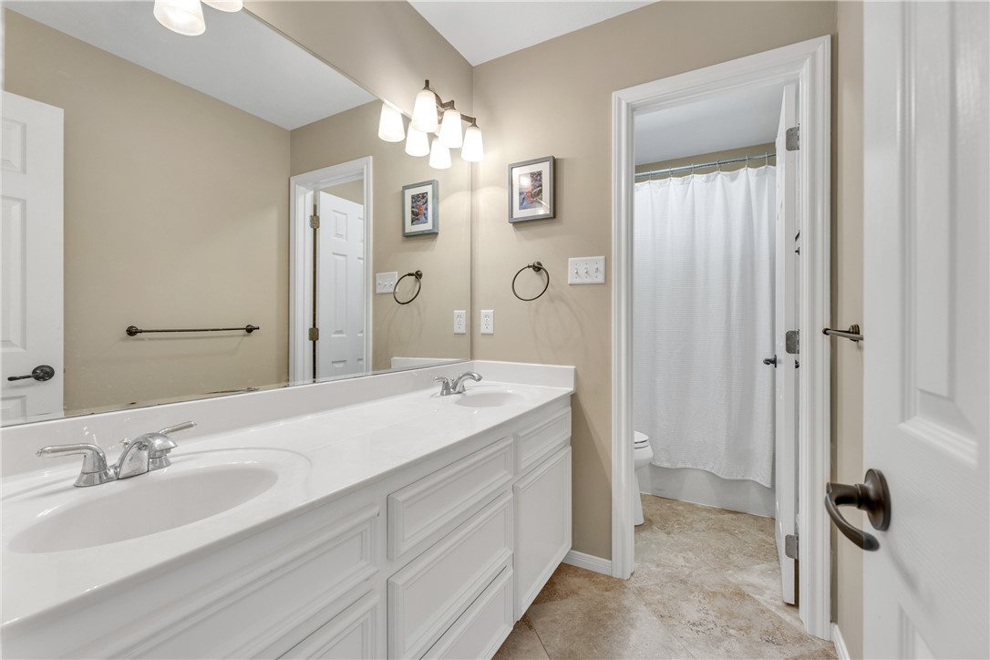 9618 Whispering Ridge College Station, TX 77845 - Photo 20 of 27 a spacious bathroom with a double vanity sink mirror and double