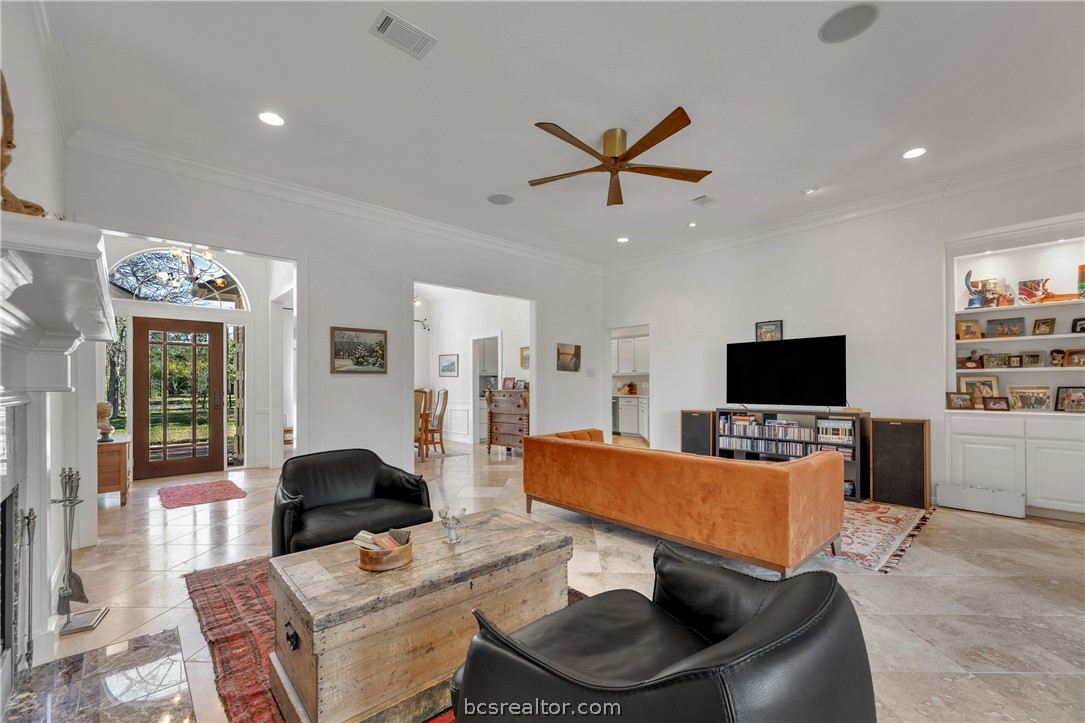 9618 Whispering Ridge College Station, TX 77845 - Photo 2 of 27 a living room with furniture and a flat screen tv
