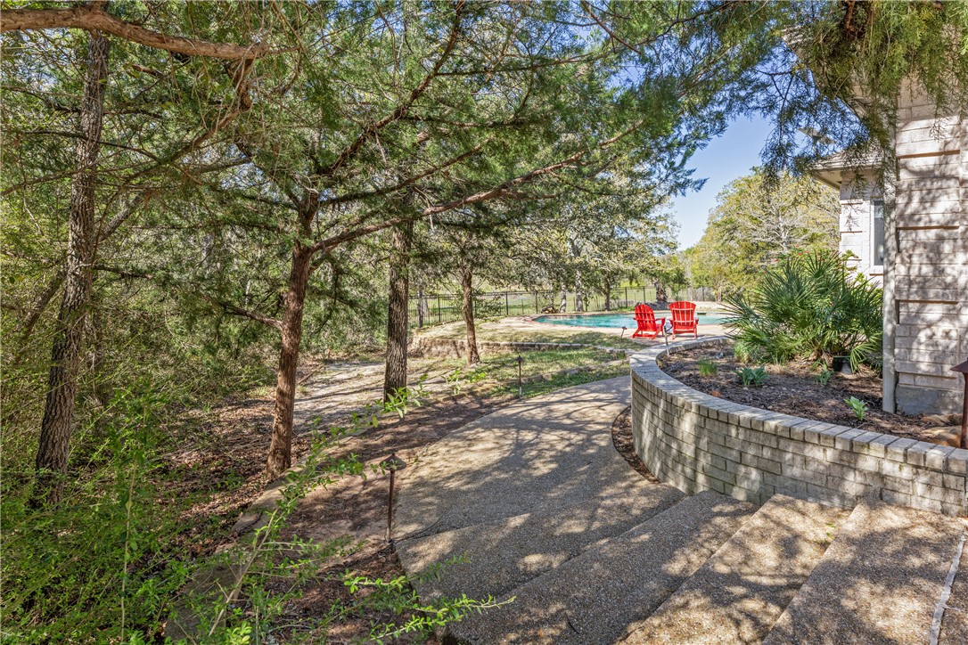 9618 Whispering Ridge College Station, TX 77845 - Photo 25 of 27 a view of an outdoor space with a tree