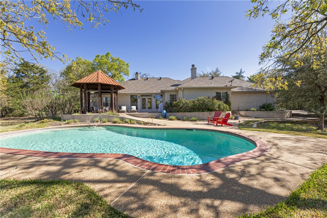 9618 Whispering Ridge College Station, TX 77845 - Photo 27 of 27 a front view of a house with garden