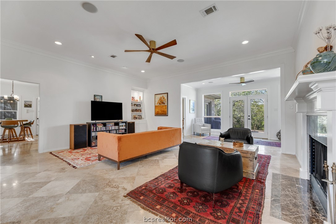 9618 Whispering Ridge College Station, TX 77845 - Photo 3 of 27 a living room with furniture and a flat screen tv