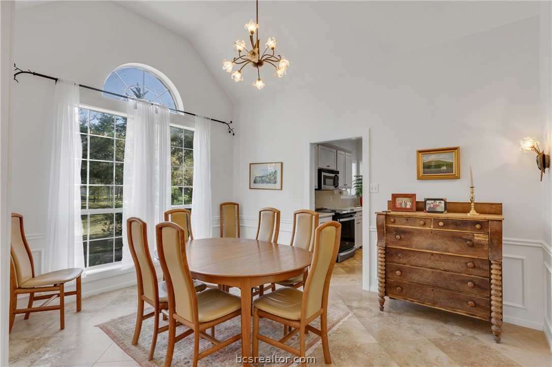 9618 Whispering Ridge College Station, TX 77845 - Photo 5 of 27 a view of a dining room with furniture and chandelier