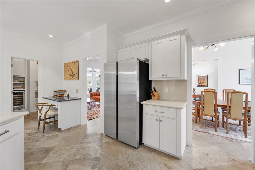 9618 Whispering Ridge College Station, TX 77845 - Photo 7 of 27 a kitchen with stainless steel appliances a refrigerator and wooden cabinets