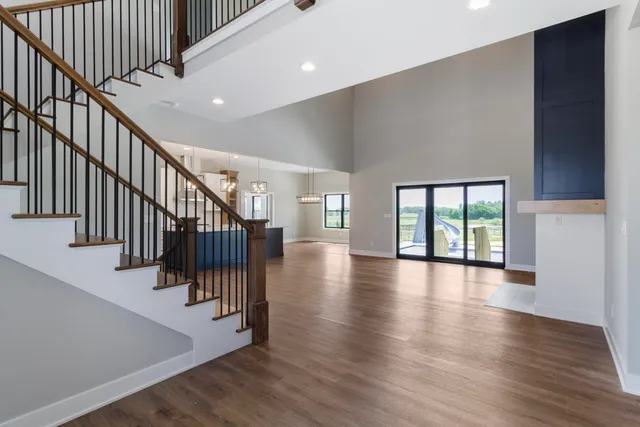 a view of staircase with white walls and a window