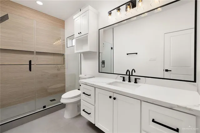 an empty room with window and wooden floor