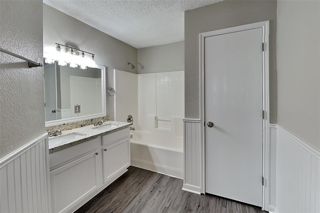 1200 Rambling Brook Trail Denton, TX 76210 - Photo 11 of 21 a bathroom with a double vanity sink and mirror