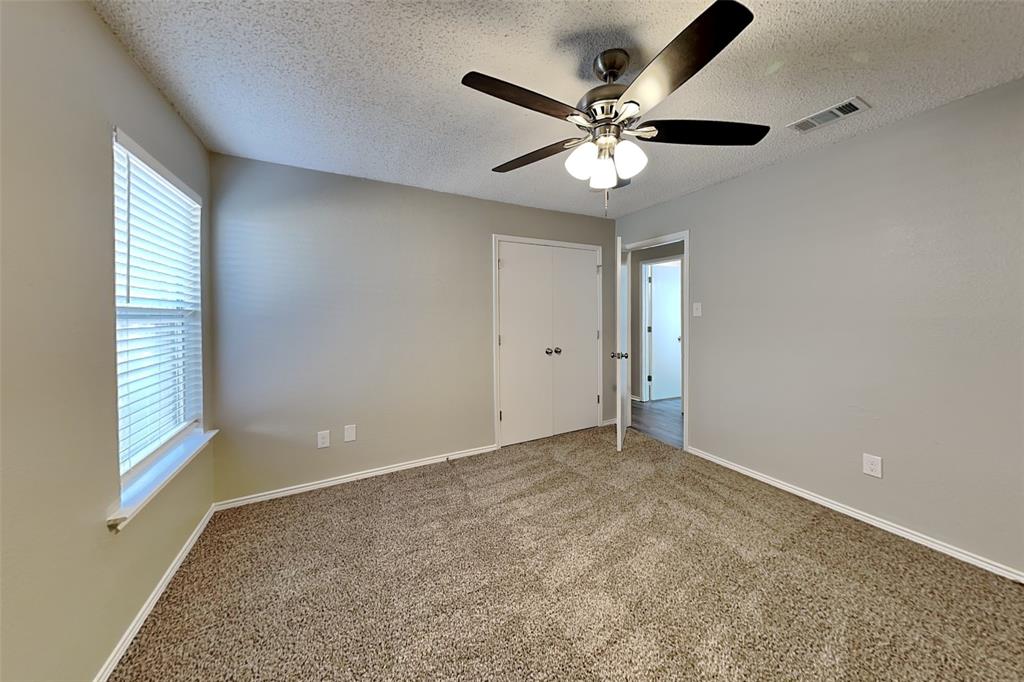 1200 Rambling Brook Trail Denton, TX 76210 - Photo 15 of 21 an empty room with windows and fan