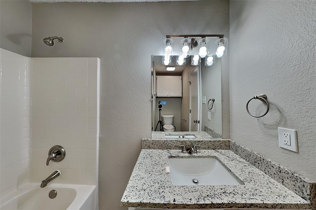1200 Rambling Brook Trail Denton, TX 76210 - Photo 18 of 21 a bathroom with a sink and a mirror