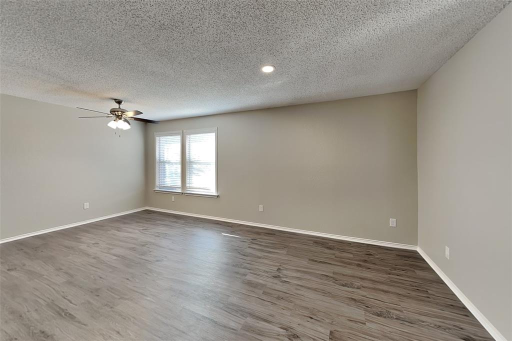 1200 Rambling Brook Trail Denton, TX 76210 - Photo 3 of 21 wooden floor in an empty room with a window