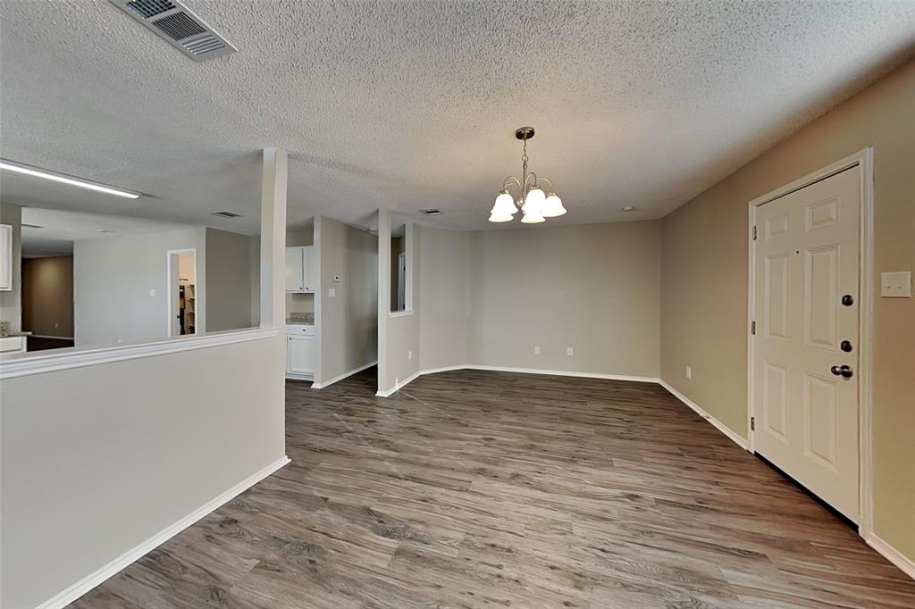 1200 Rambling Brook Trail Denton, TX 76210 - Photo 5 of 21 wooden floor in an empty room with a window