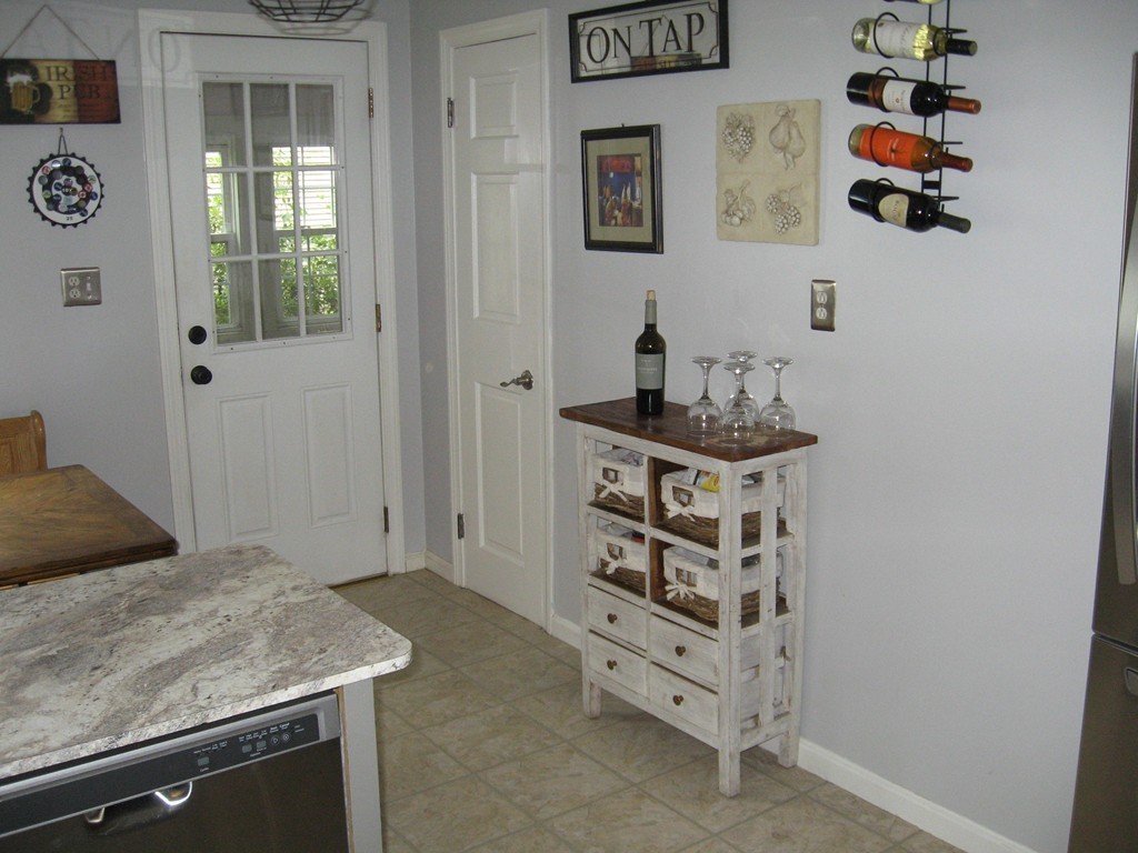 59 Mayflower Road Springfield, MA 01118 - Photo 12 of 27 a room with a door and a cabinet