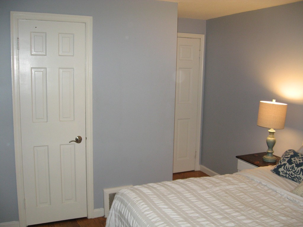 59 Mayflower Road Springfield, MA 01118 - Photo 16 of 27 a bedroom with a bed and a lamp