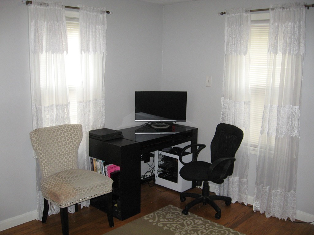 59 Mayflower Road Springfield, MA 01118 - Photo 17 of 27 a view of a workspace with furniture and a window