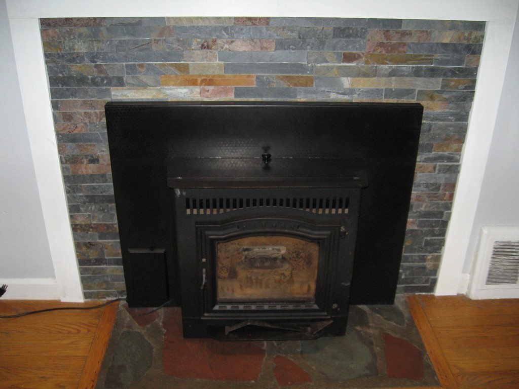 59 Mayflower Road Springfield, MA 01118 - Photo 7 of 27 a closeup of a fireplace