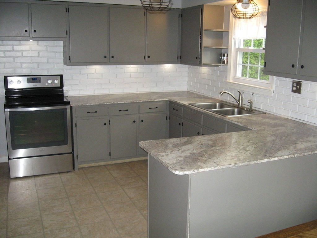 59 Mayflower Road Springfield, MA 01118 - Photo 8 of 27 a kitchen with a sink and cabinets