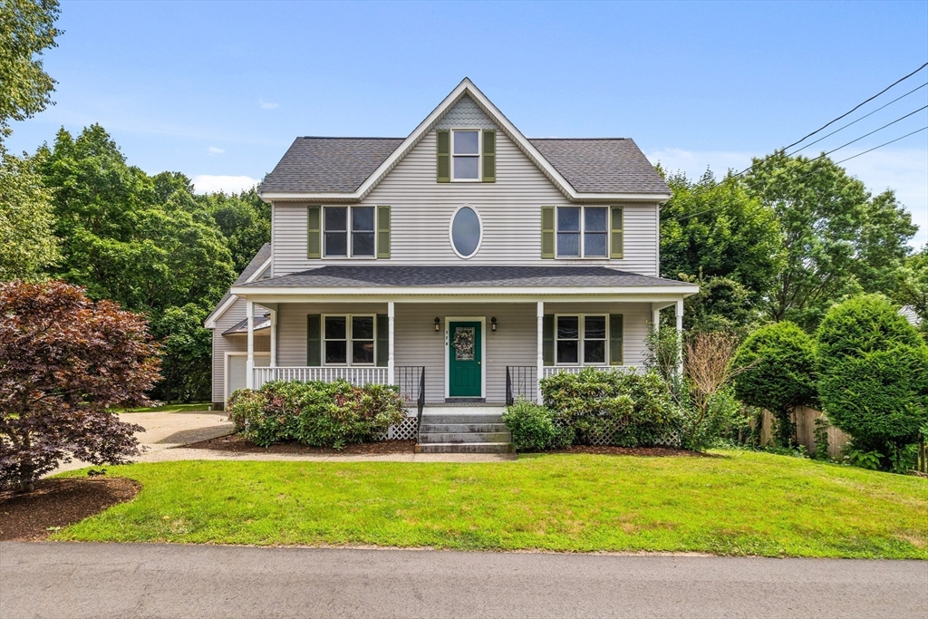 378 Central Avenue Needham, MA 02494 - Photo 1 of 5 a front view of a house with a garden and yard