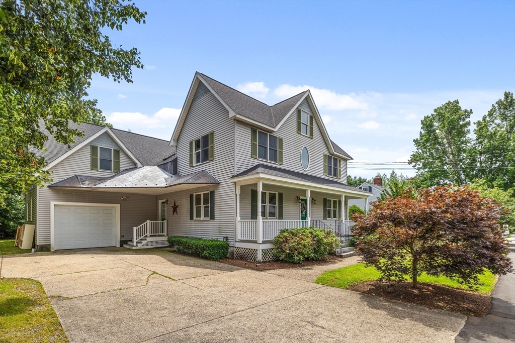 378 Central Avenue Needham, MA 02494 - Photo 2 of 5 a front view of a house with a garden