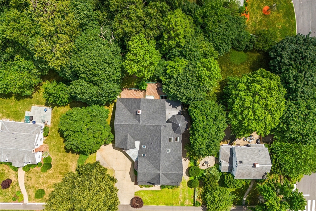 378 Central Avenue Needham, MA 02494 - Photo 4 of 5 an aerial view of a house with a yard and trees all around
